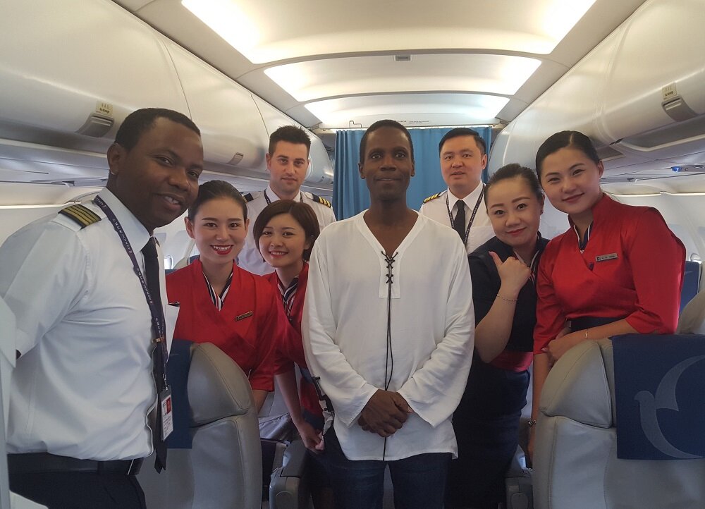 Ron, Jamaican pilot, and crew, fly me to Vietnam with a complimentary first class upgrade!